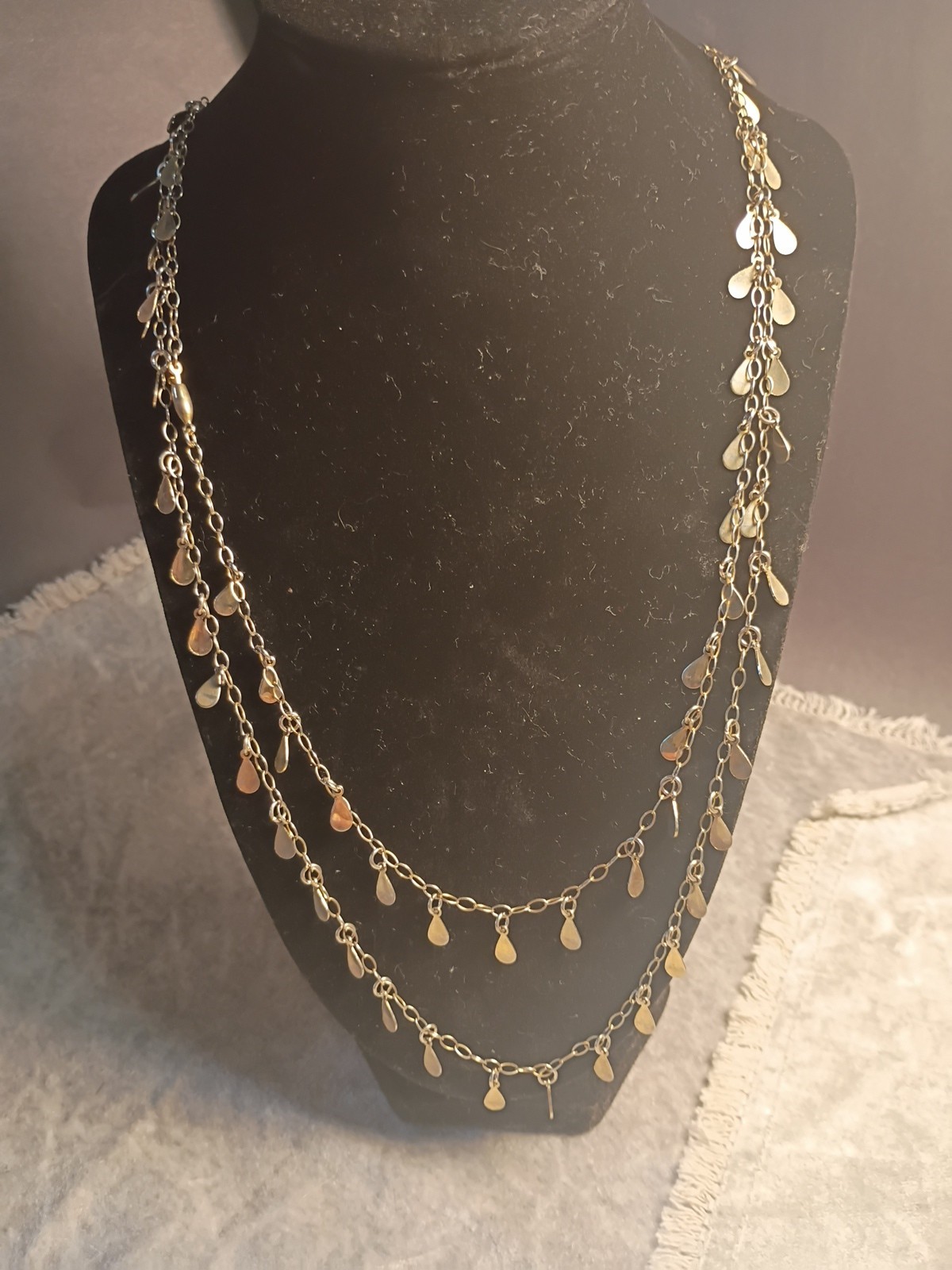 Gold Toned Tear Drop Charmed 56 Inch Taper Single Strand Necklace. J2