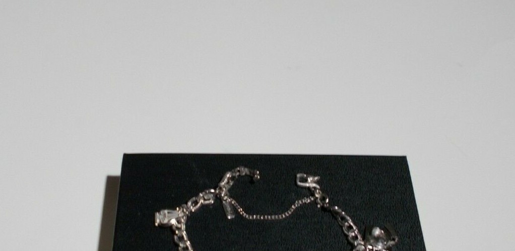 VTG MONET Bracelet with 4 Charms Size 7in Silver Ton Safety Chain 
