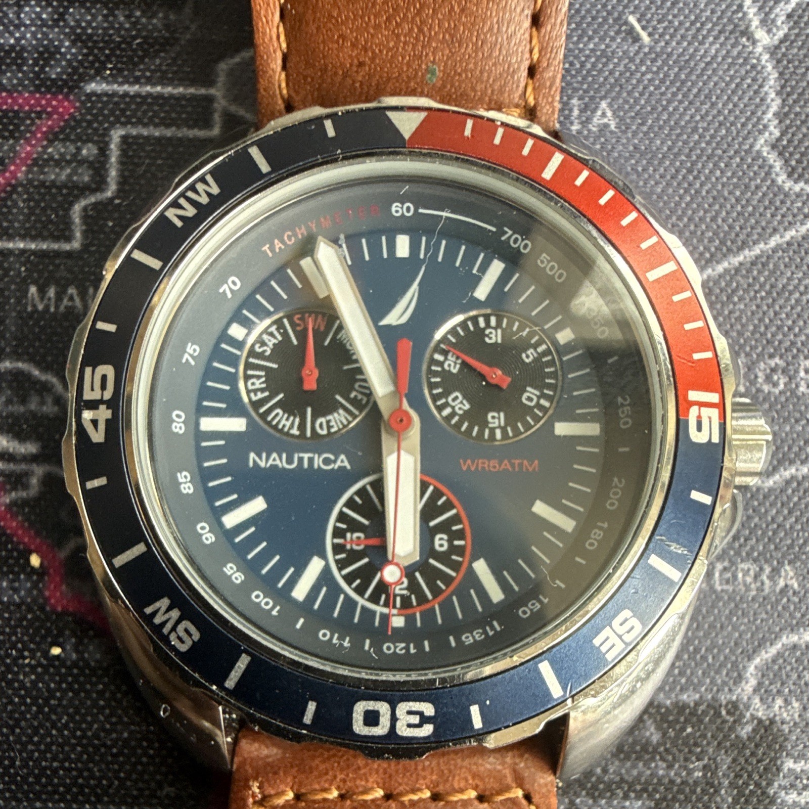 Nautica Men’s Quartz Sport Chronograph Tachymeter Blue Dial Red/Blue Bezel