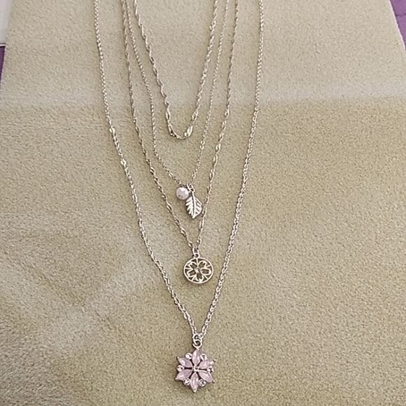 Claire’s silvertone multi-strand necklace with pink flower pendant