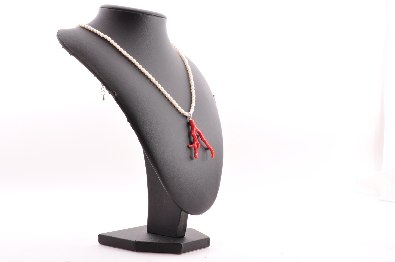 Sterling silver clasp, red coral and pearl pendant (total 54.0ct) Certification.