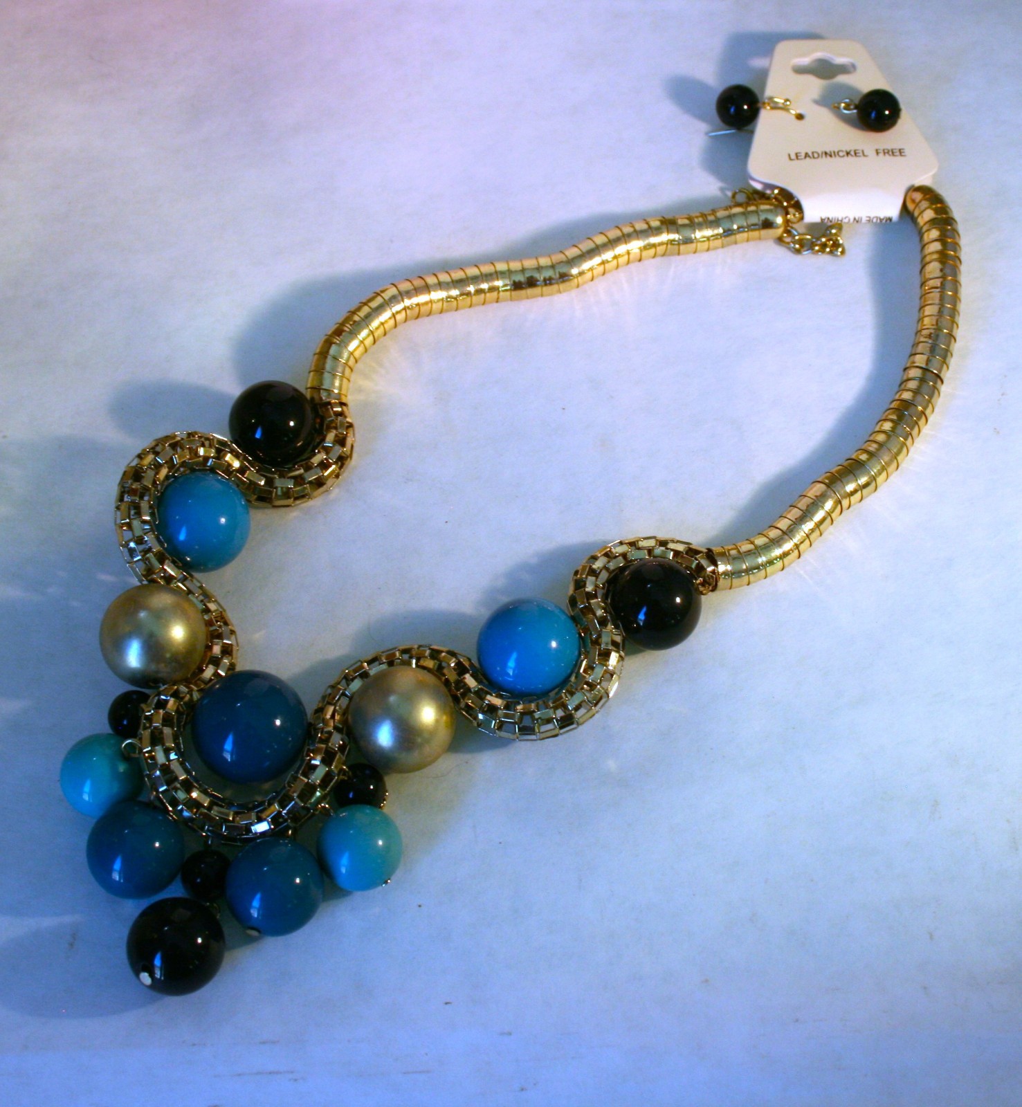 Gold tone large blue, black, gold beads statement necklace 18″ + 2″ & earrings