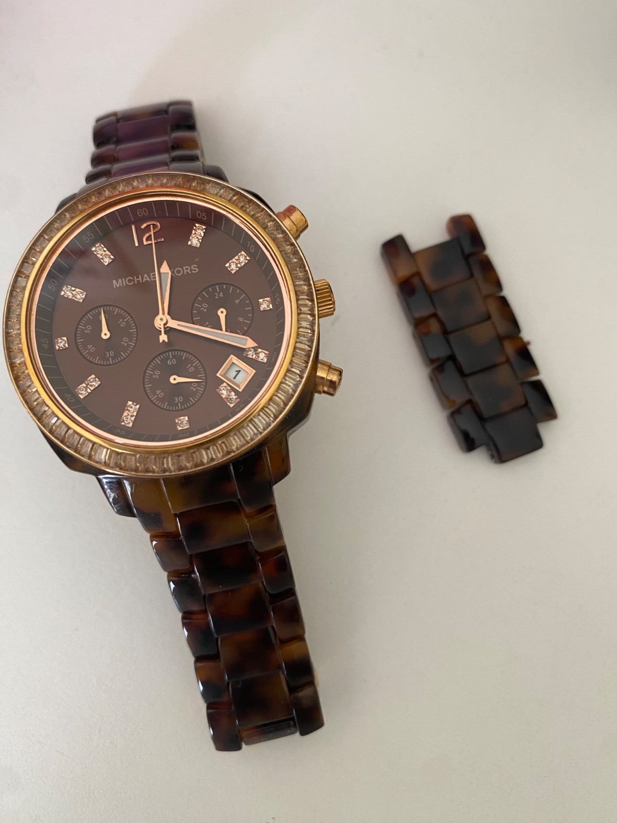 Michael Kors Watch for Women. Stainless steal case back, tortoiseshell wristband