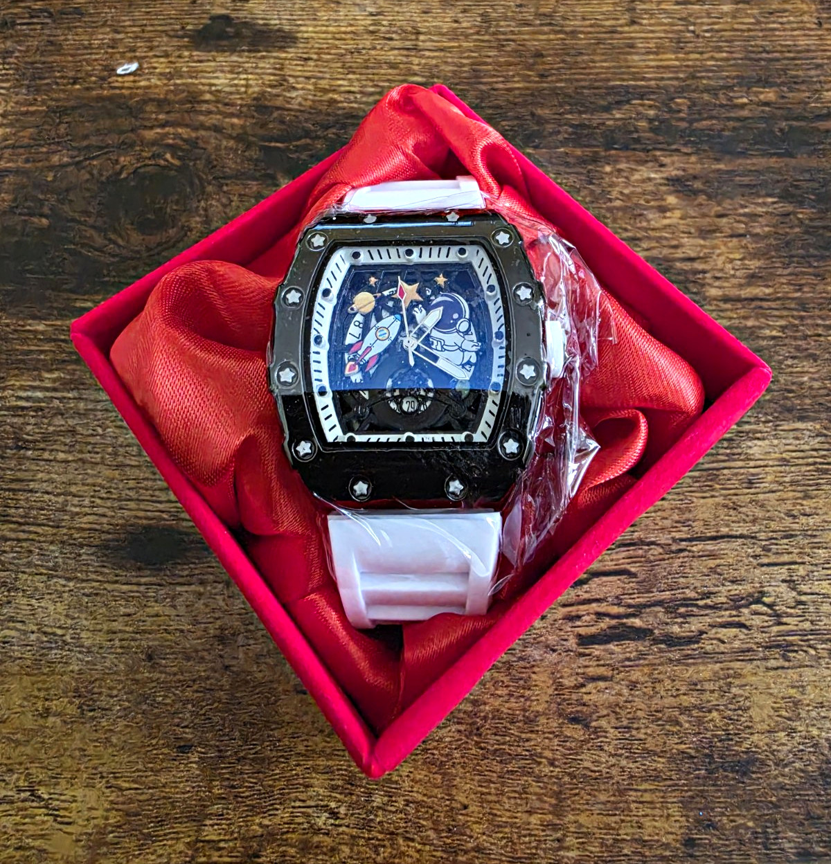 Statement Tonneau Sport Watch Bezel: Matte black tonneau case w/ star screws