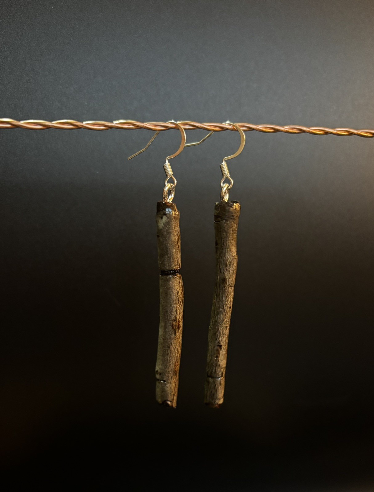 One of a kind jewelry made from real pieces of wood coated in resin