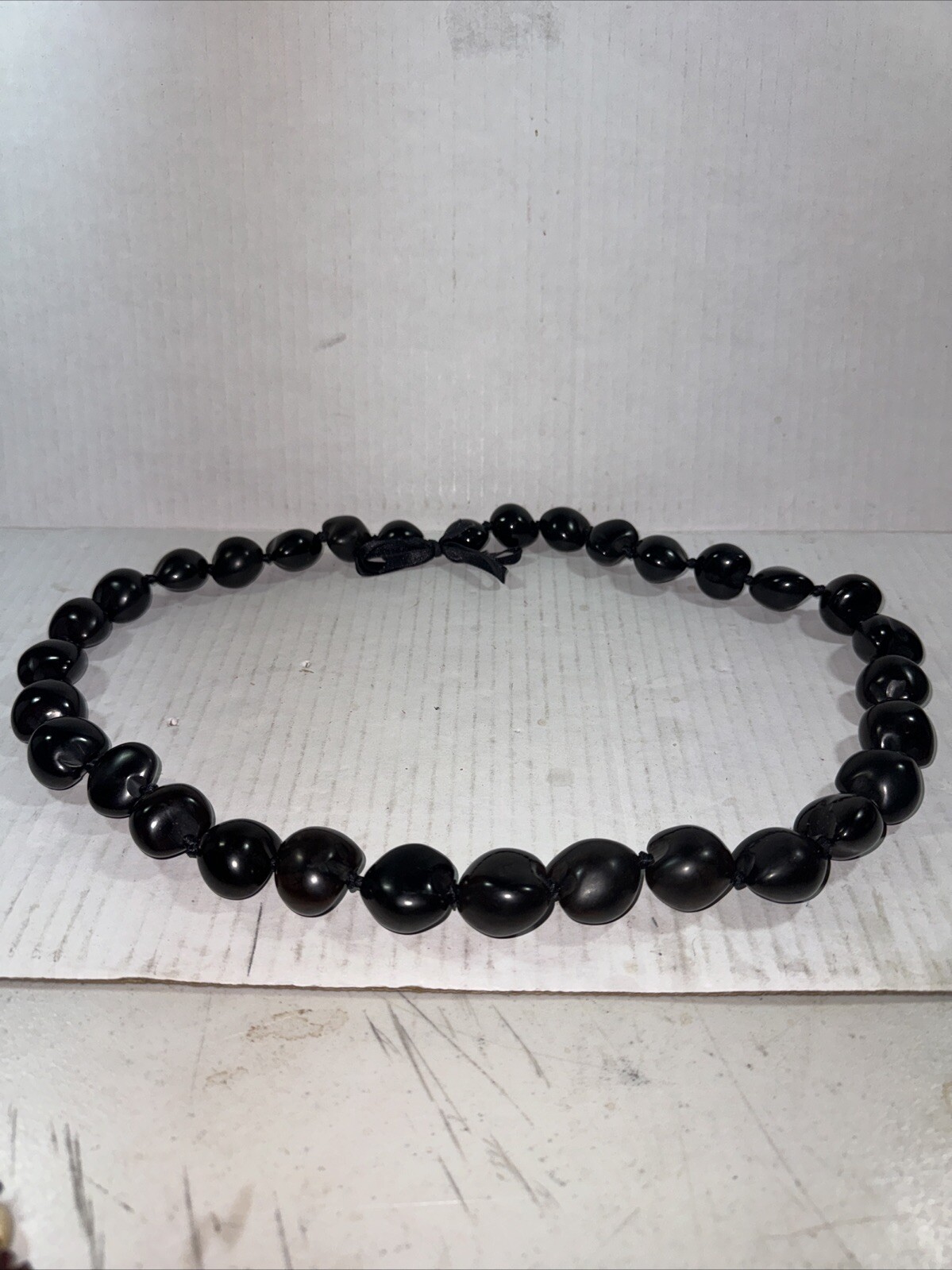 Vintage necklace large dark brown Kukui Nut lei Hawaiiana Black ribbon 12 In.