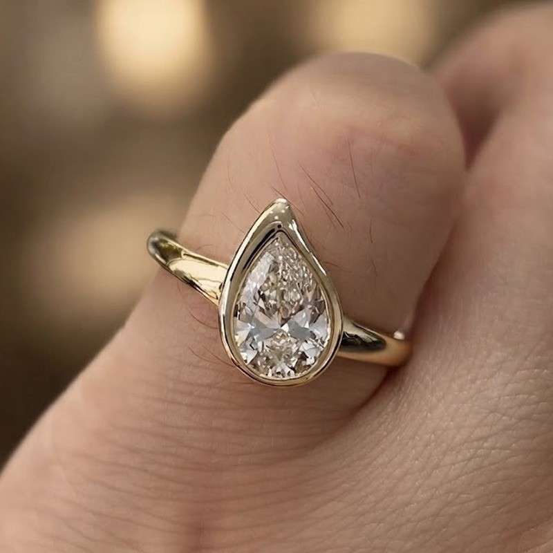 1.90 CT Pear Cut Moissanite Bezel Set Engagement Ring in 14K Yellow Gold Plated
