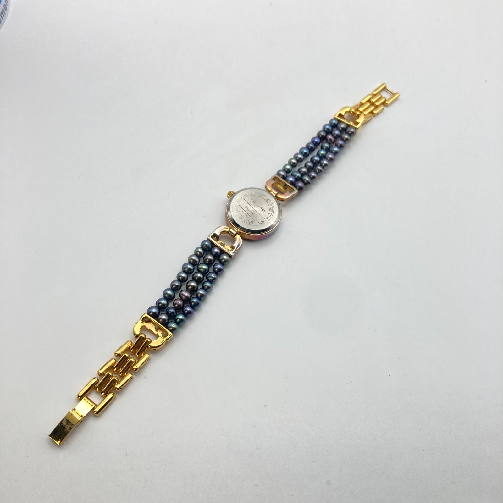 Lee Sands Women’s Watch 22mm Gold Tone MOP Iridescent Beads New Battery 7″