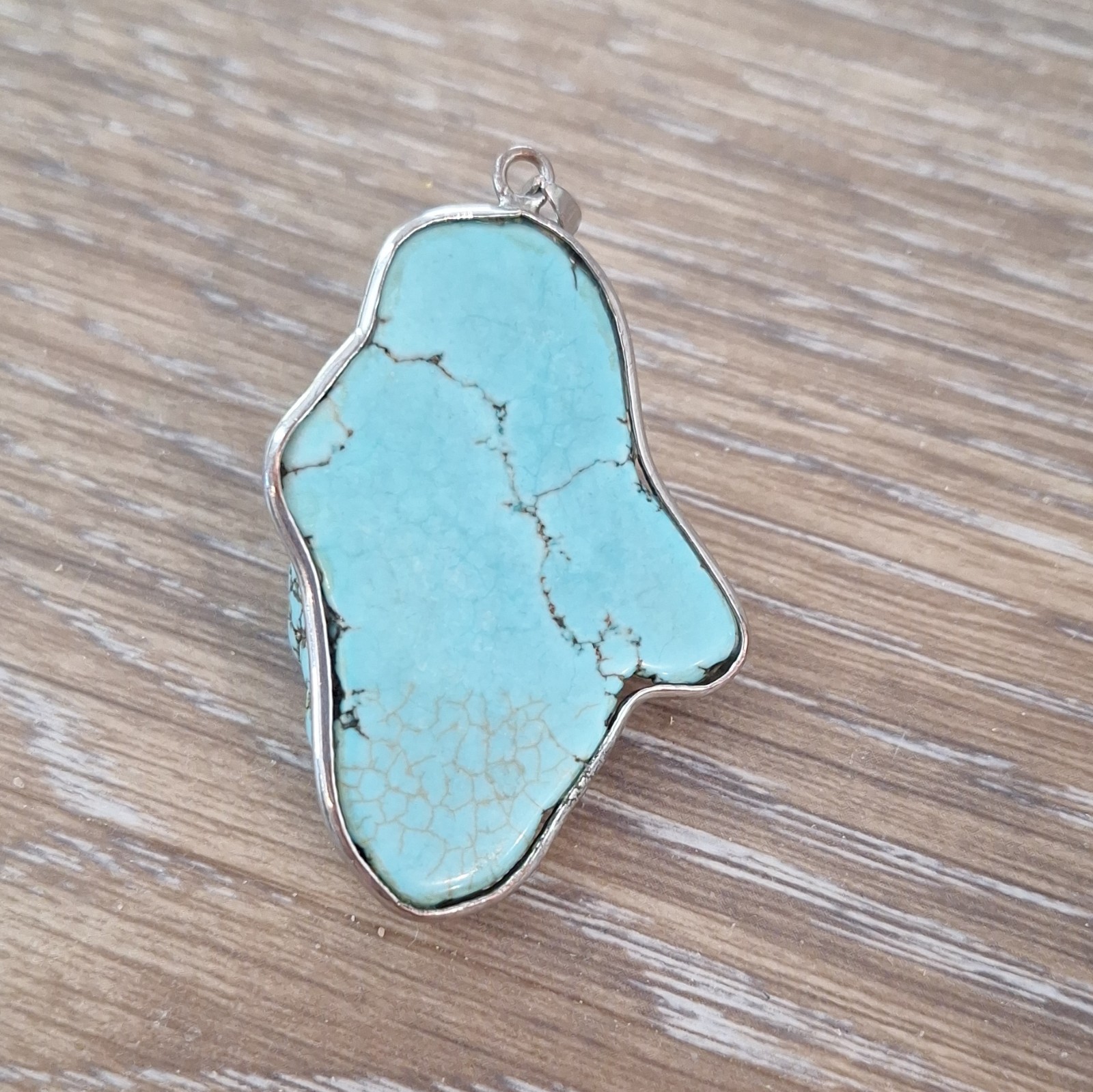 Blue turquoise Stone Pendant Charm with silver outline.