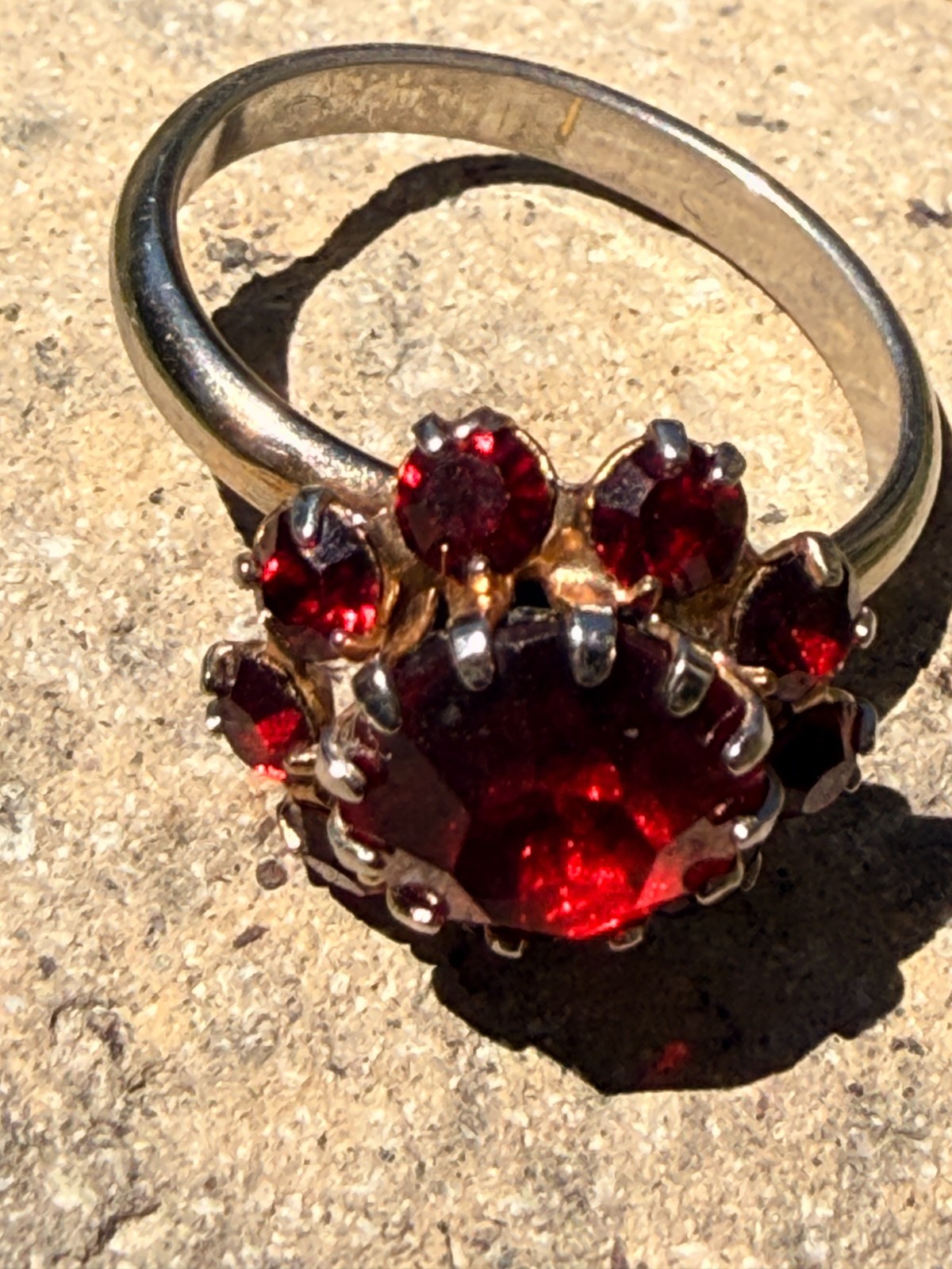 Deep Burgundy ring features a cluster of red rhinestones in a gold-tone setting.