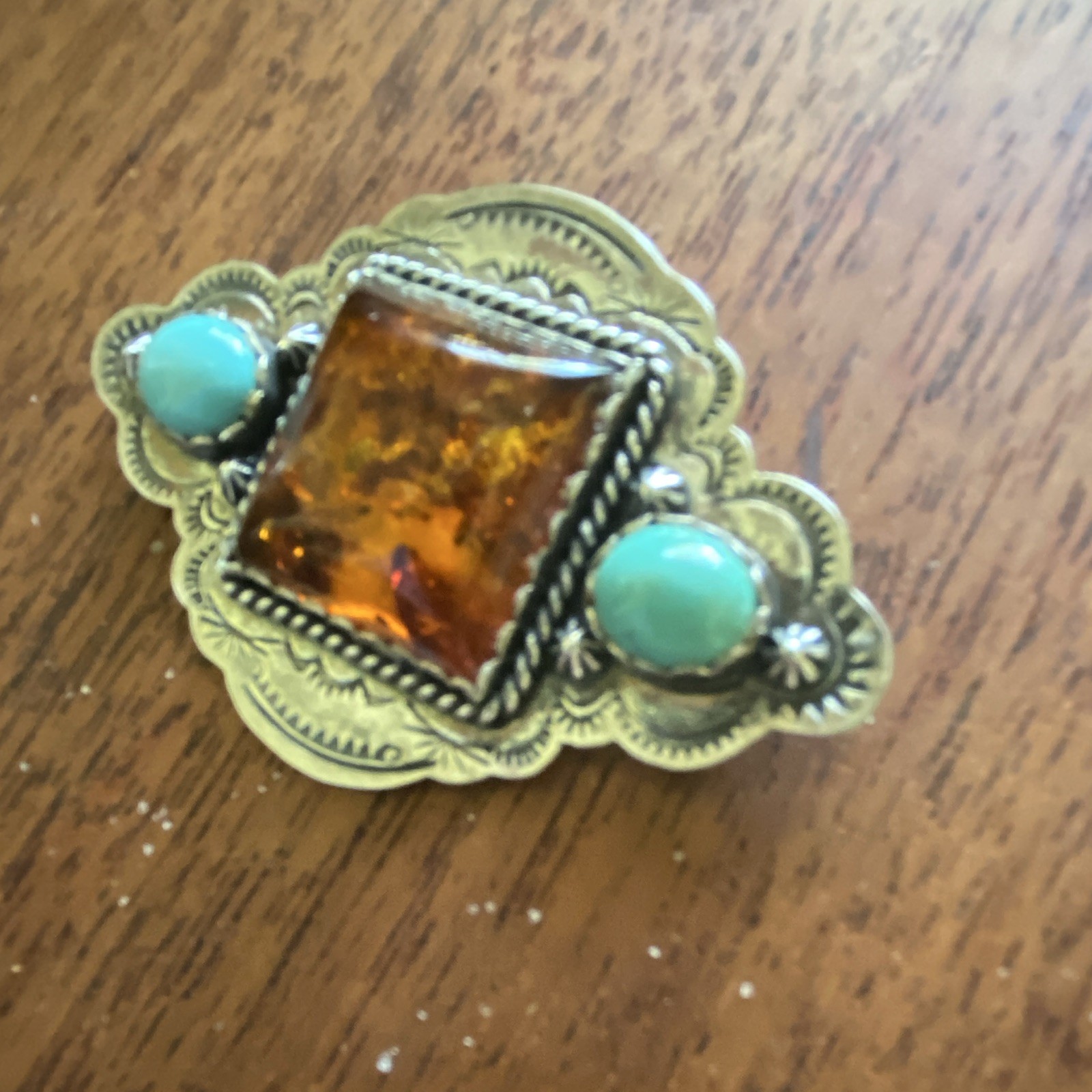 Sterling brooch, Amber Centerstone with turquoise side stones signed it is 2 1/2