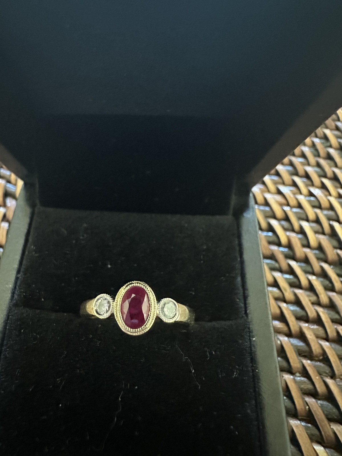 Ruby and Diamond Bezel set ring in 14K yellow gold size 5.5