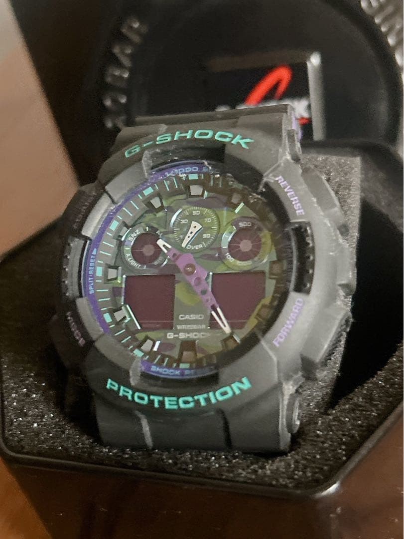 G SHOCK GA 100 1A purple camouflage