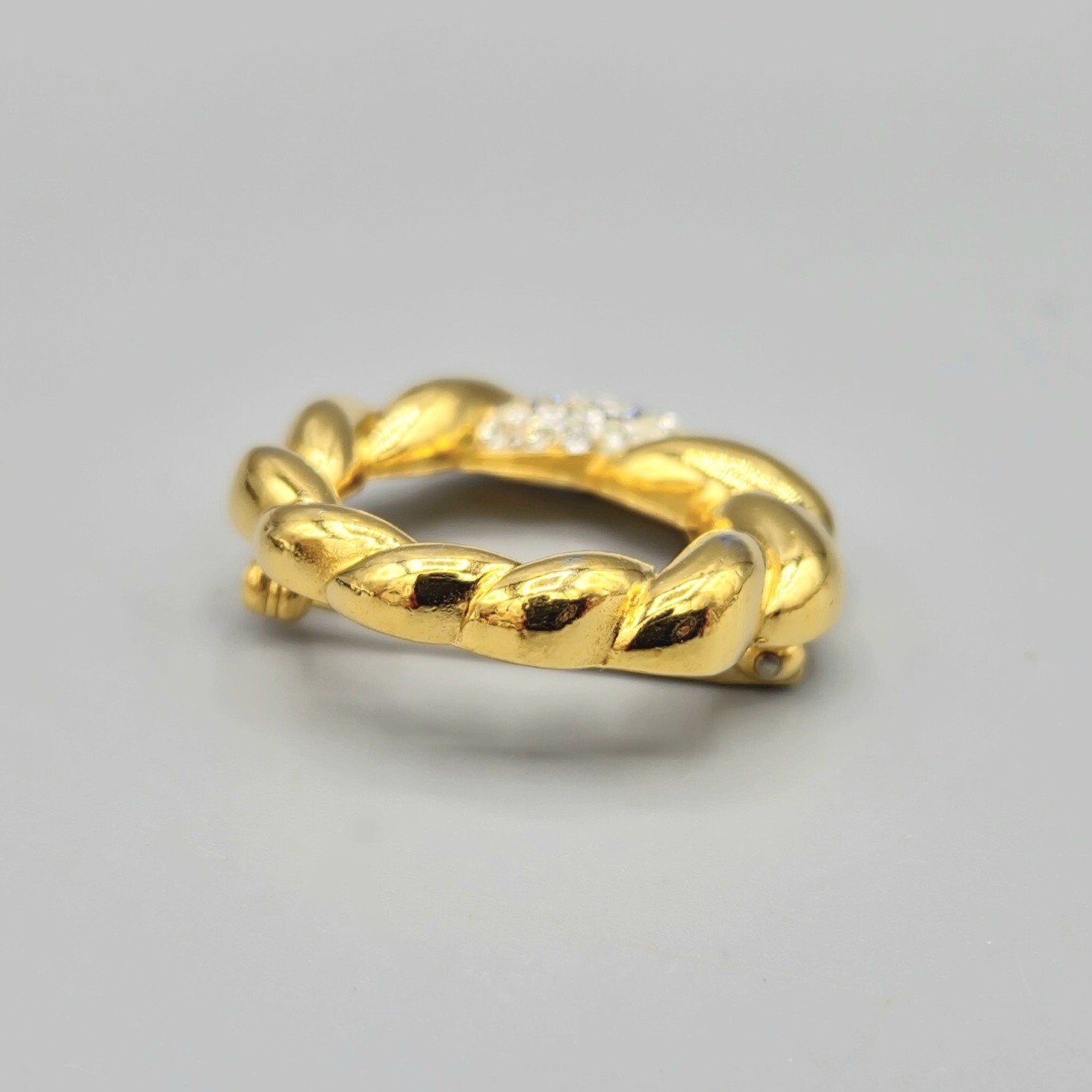 Crown Trifari Polished Gold Tone Crystal Pave Open Circle Twist Brooch