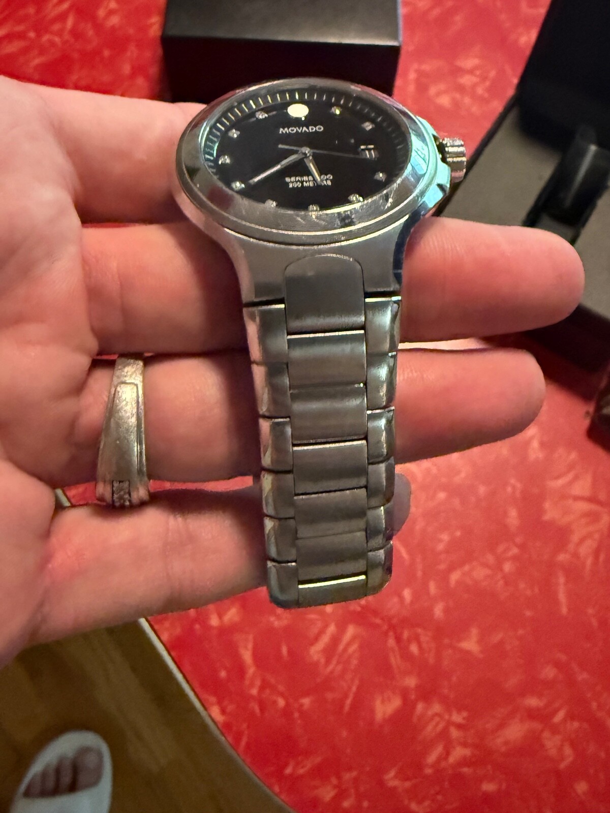 MOVADO 800 SERIES WATCH WITH BLCK BEZEL AND DIAMOND MAKERS – MENS WATCH