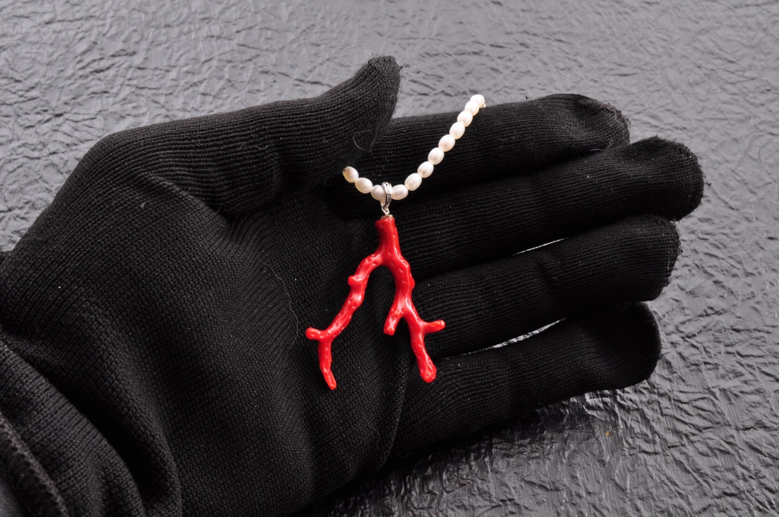 Sterling silver clasp, red coral and pearl pendant (total 54.0ct) Certification.