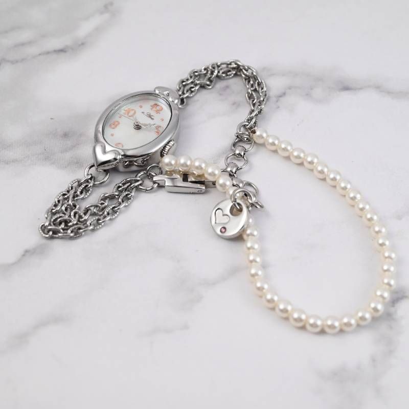 sara ladies’ wristwatch pearl bracelet watch oval shell dial heart motif silver