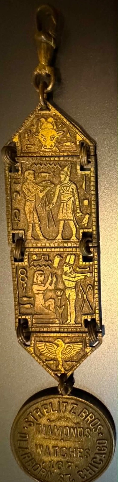 Watch fob: RARE STRELITZ BROS ad on 1906-8 Egyptian Sears watch fob (Lot #291)