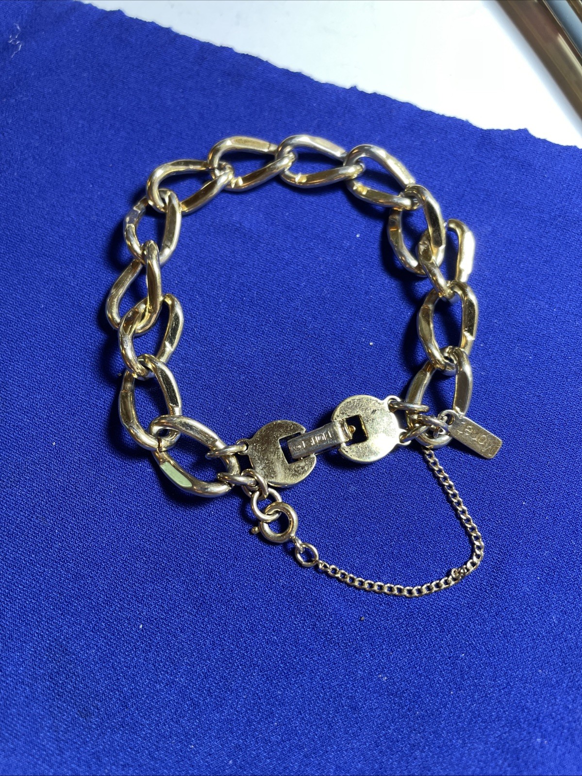 Monet GOLD tone link bracelet with safety chain
