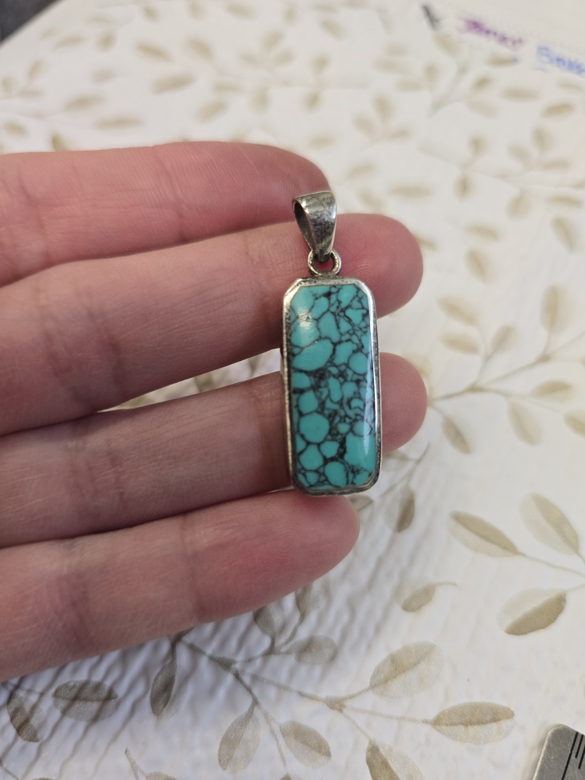 Sterling silver (925) turquoise pendant featuring a rectangular cabochon