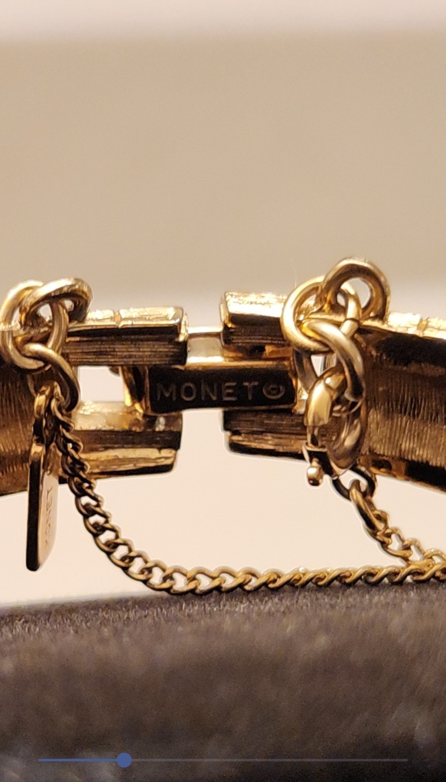 Monet gold tone bracelet with safety chain w/shiny and matte finish