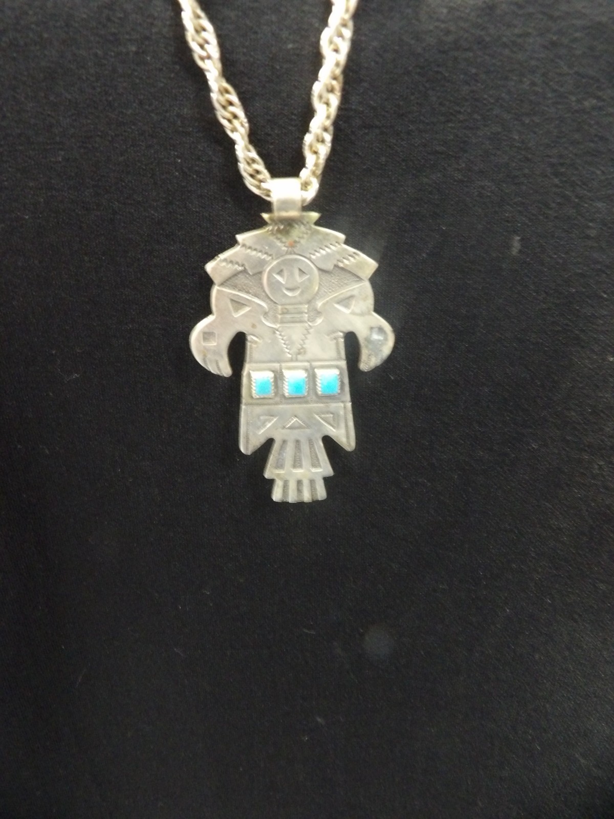 Navajo Kachina Totem Turquoise BRanded Nickle Silver Bell w/28″ Braided Chain.
