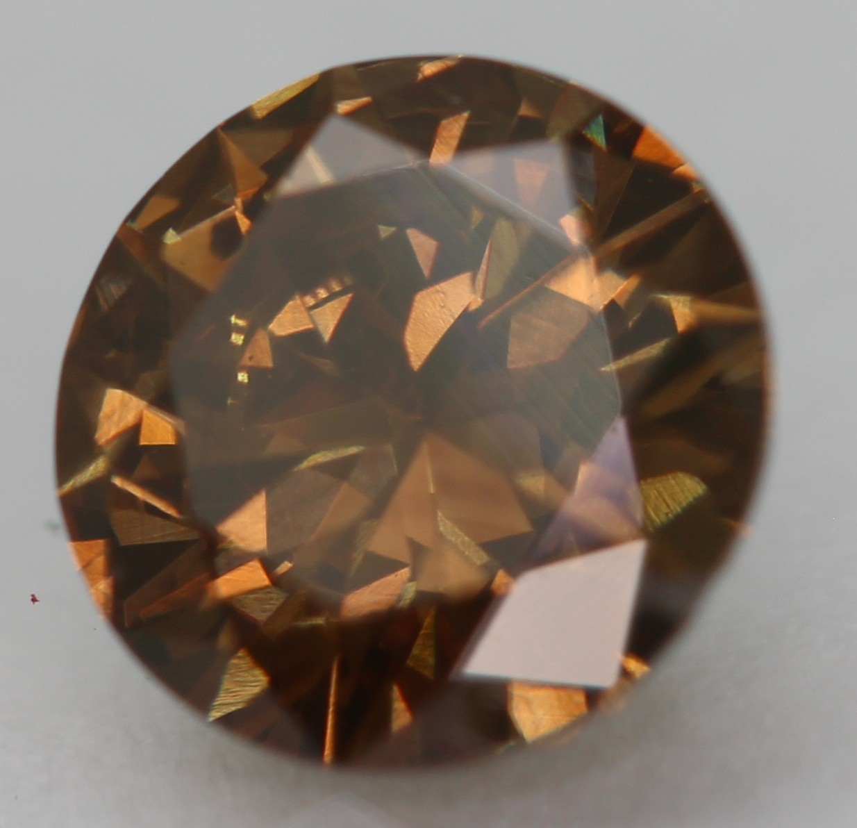 0.52 Carat Orangy Brown VVS2 Round Brilliant Natural Enhanced Diamond 5.4m VIDEO