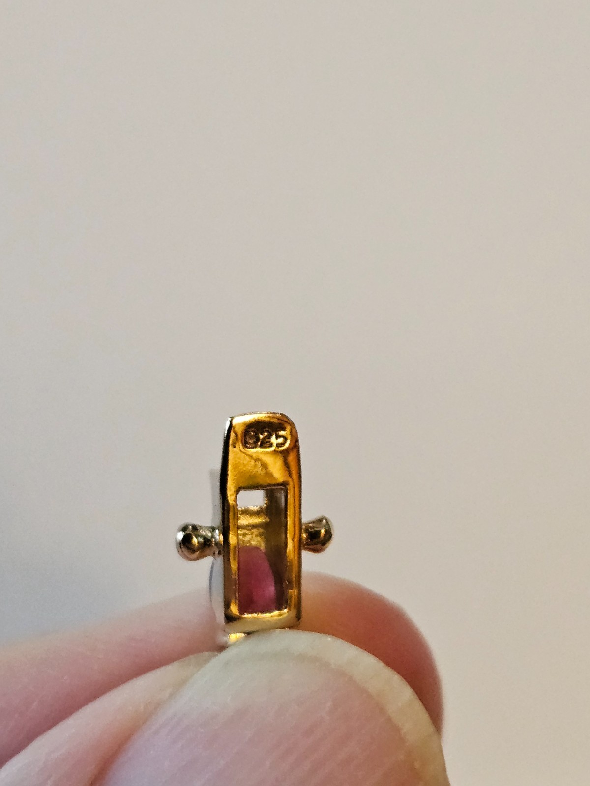 .925 marked with gold tone tourmaline tennis bracelet. Tested by presidium.