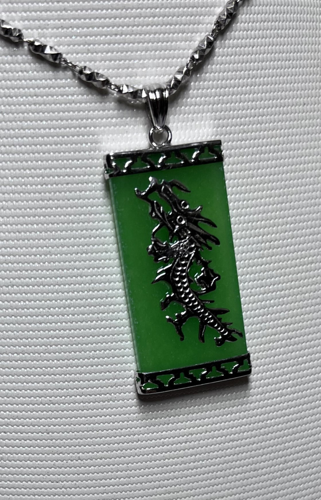 15×30 mm green jade pendant set in sterling silver (925) with dragon design