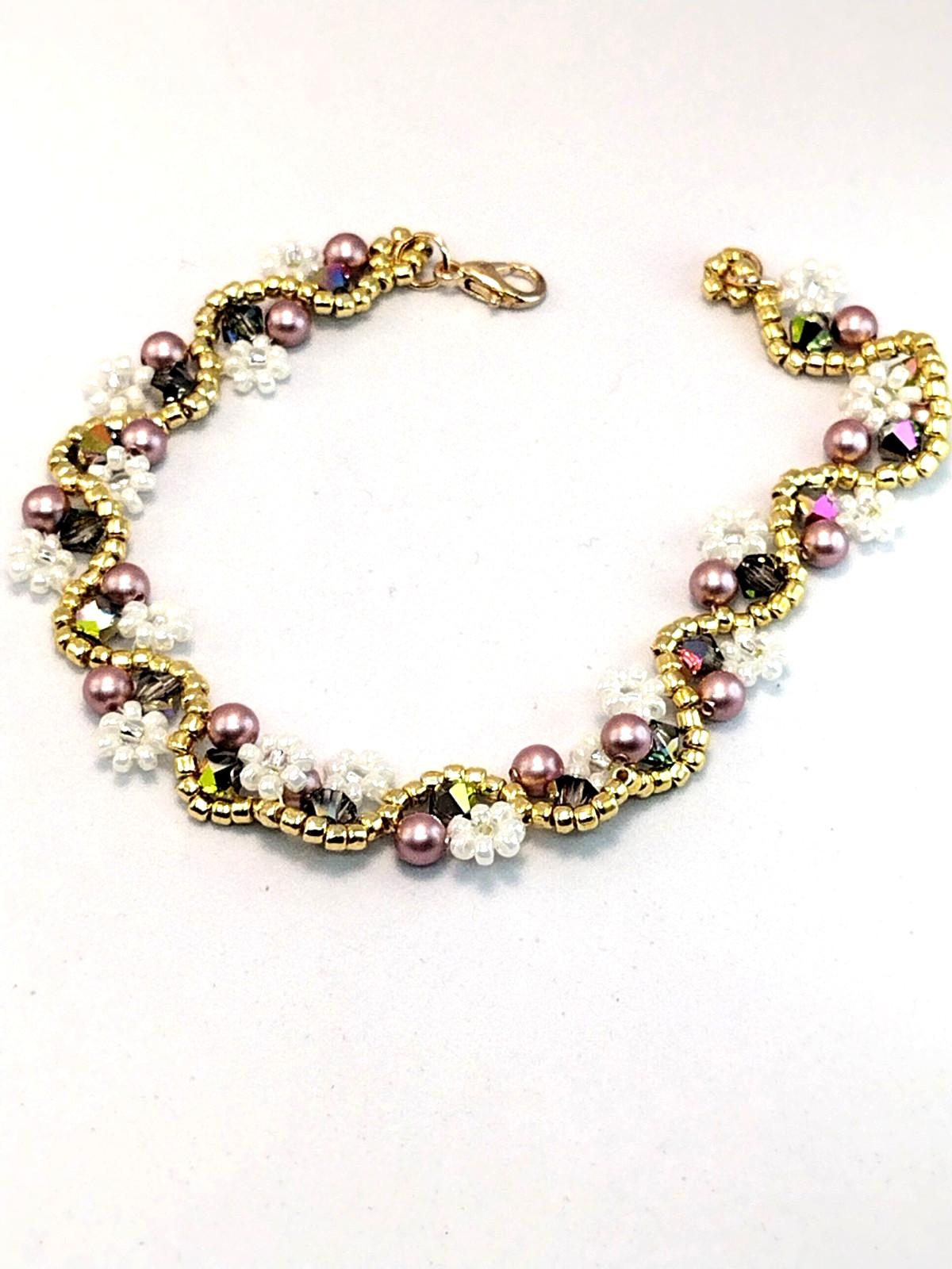 Bracelet 8-inch White Flower, 4mm Green Hue Crystal Bicone & 4mm Pink Pearl.
