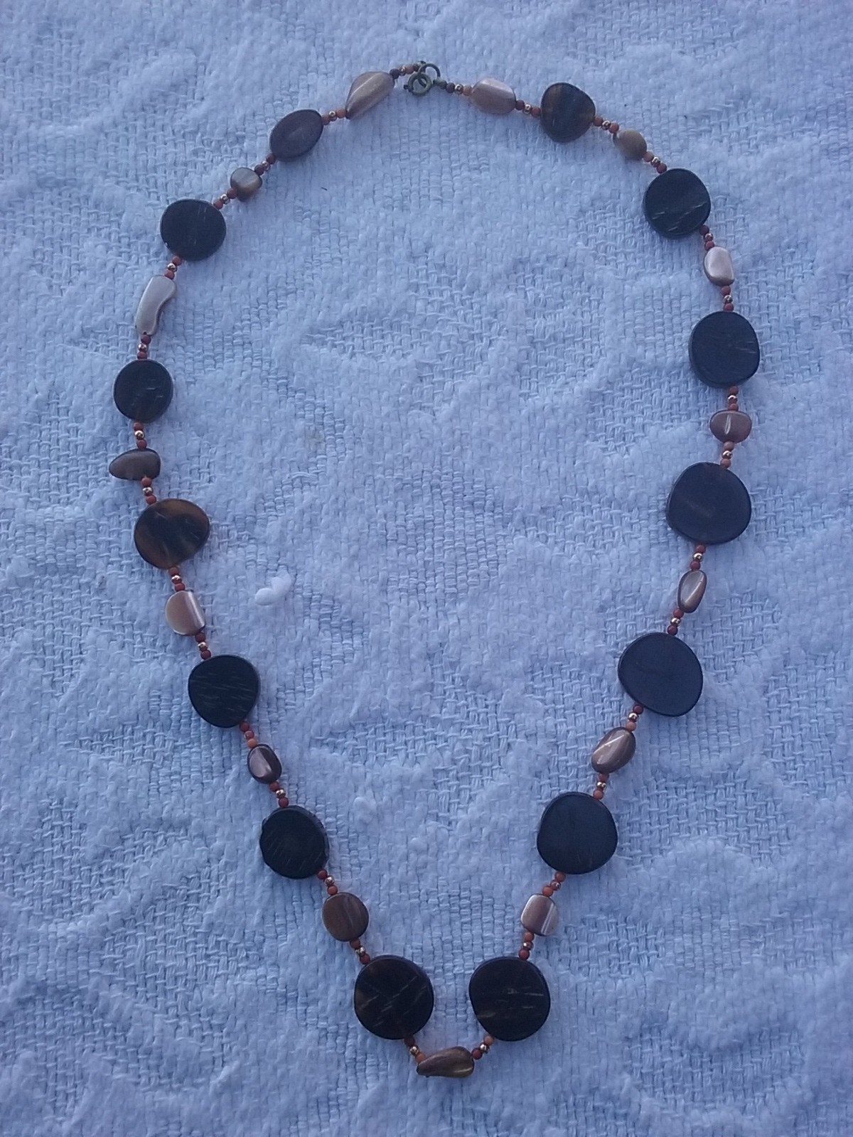 NECKLACE – UN-MARKED 28″ -COIN SHAPED BEADS
