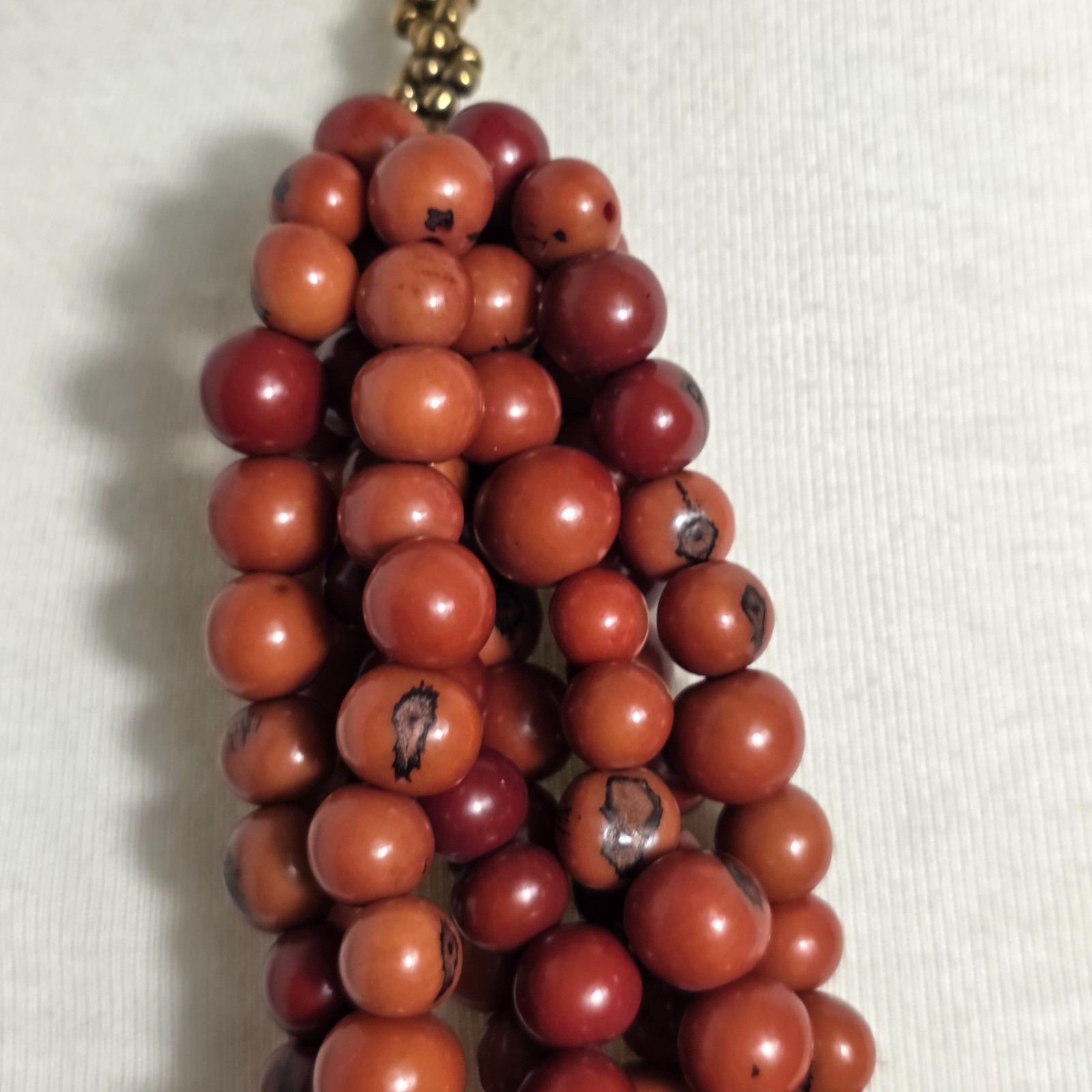 Multi-Strand Dyed Coral Colored Acai Seed Bead Necklace Gold Seed Bead Accents