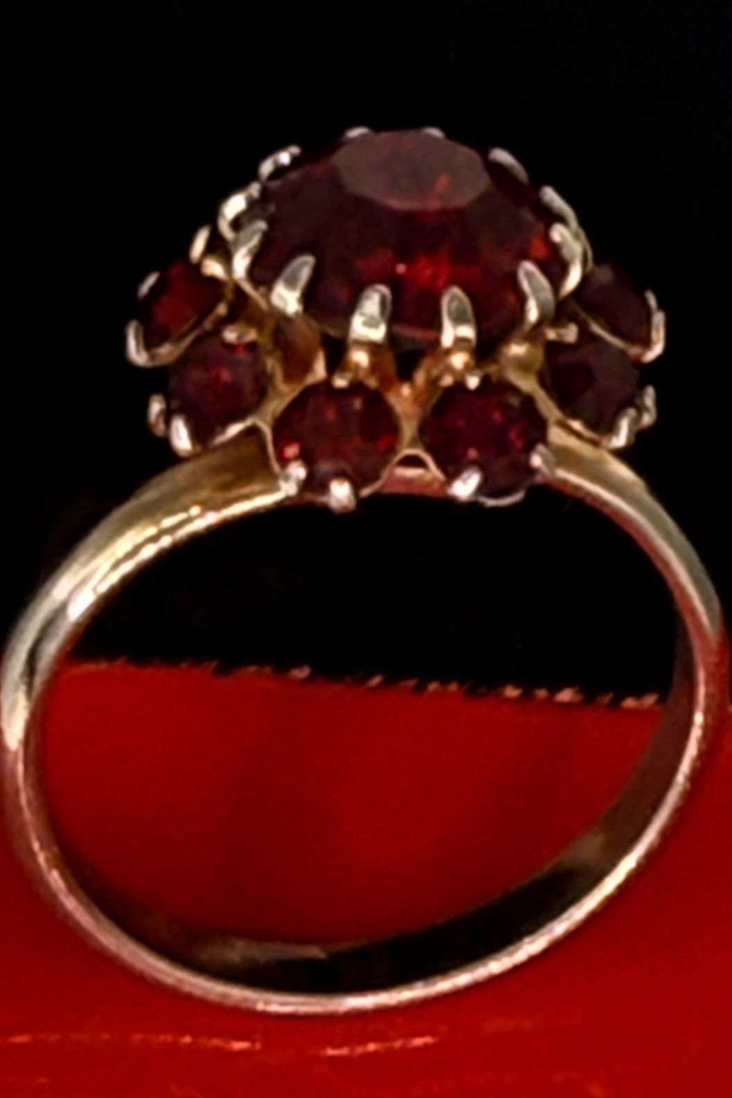 Deep Burgundy ring features a cluster of red rhinestones in a gold-tone setting.