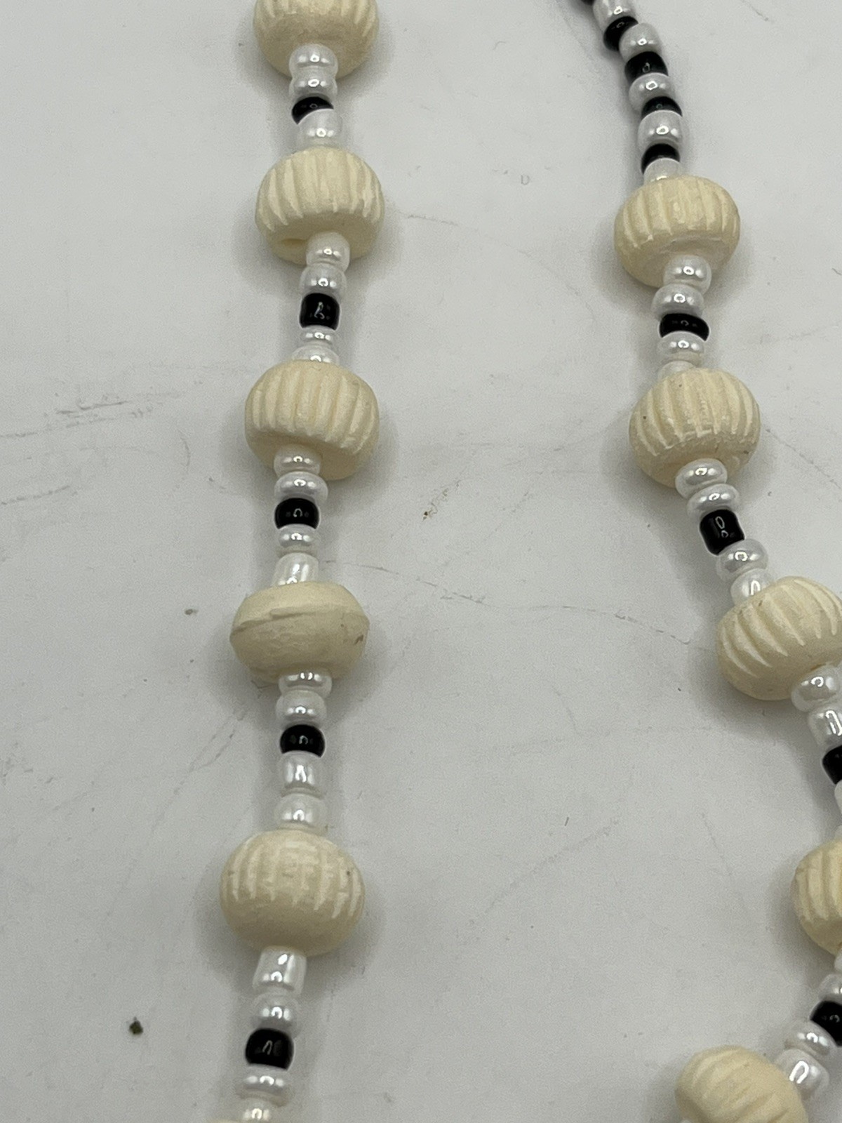 Carved Pendant Black and White Beaded Necklace 20”