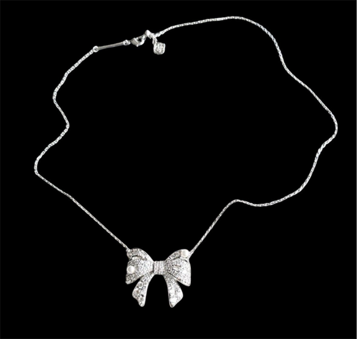 New Krista Silver Bow Short Pendant Necklace in White Mix on Kendra Scott Card