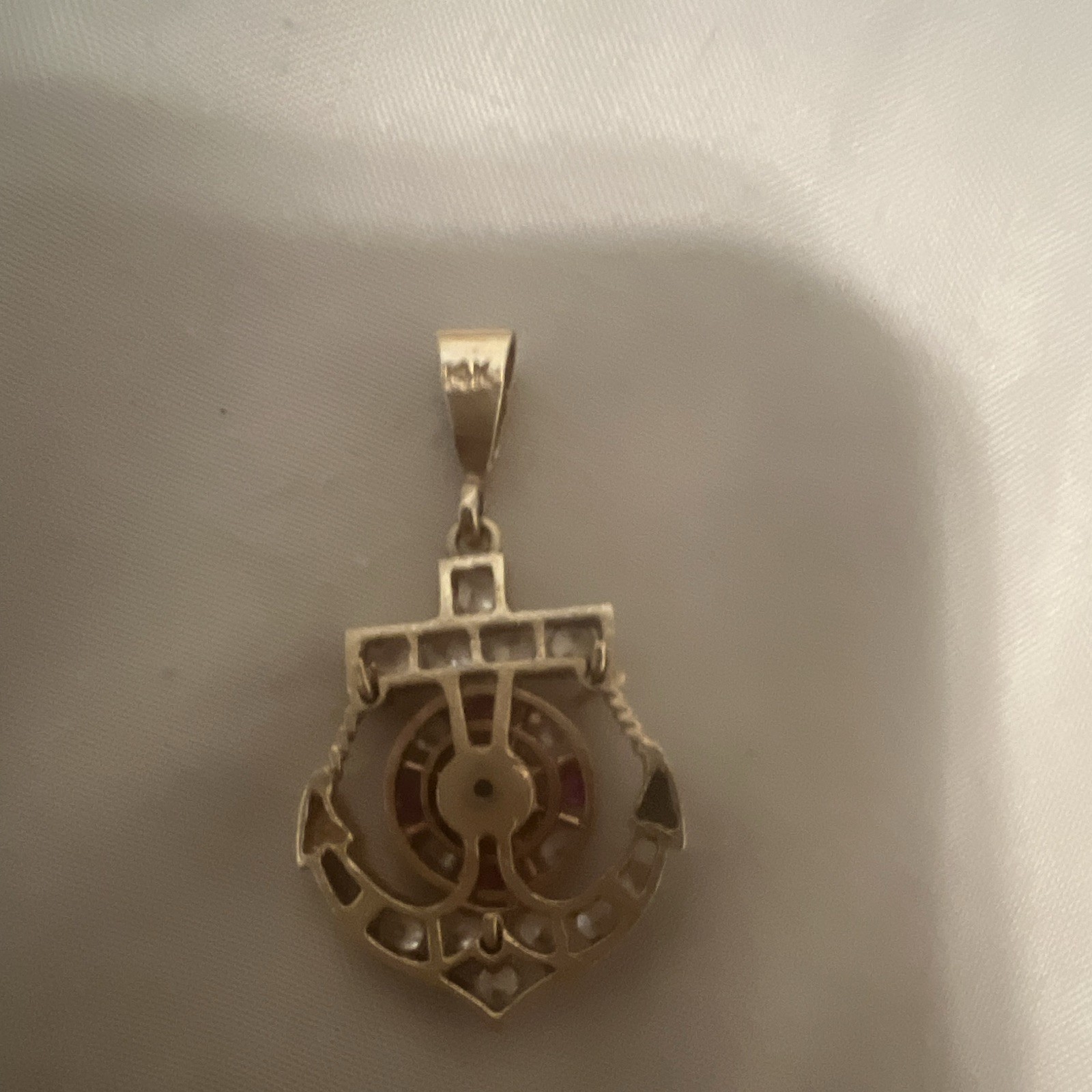 14 gold. Nautical Anchor Charm Pendant w/ Clear diamonds en ruby red. 5 grams