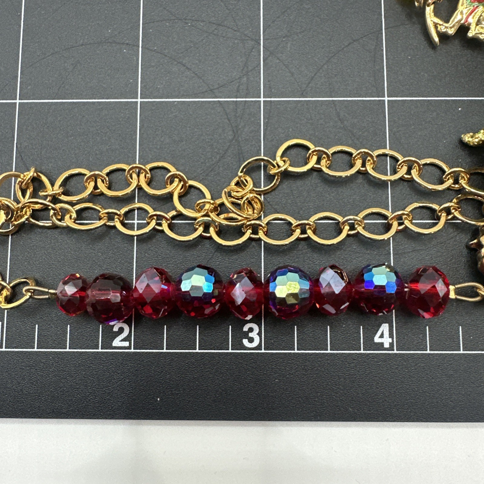 Kirks Folly Brass/Gold-Tone “Ouch the Elf” Red Bead Necklace 29 1/2″ Necklace