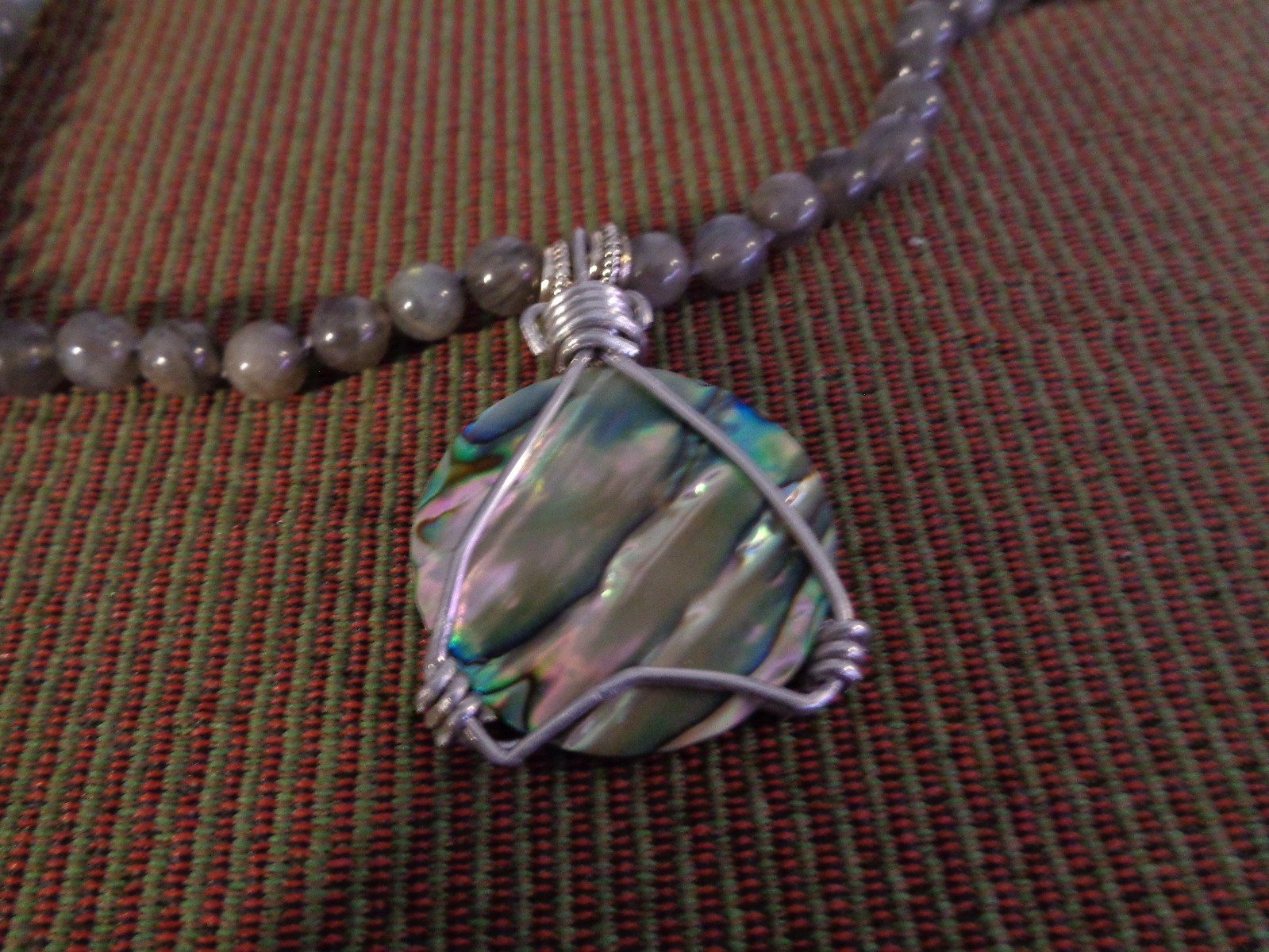 Artisan crafted, gorgeous, aluminum wrapped Paua pendant, on 19” Labradorite str