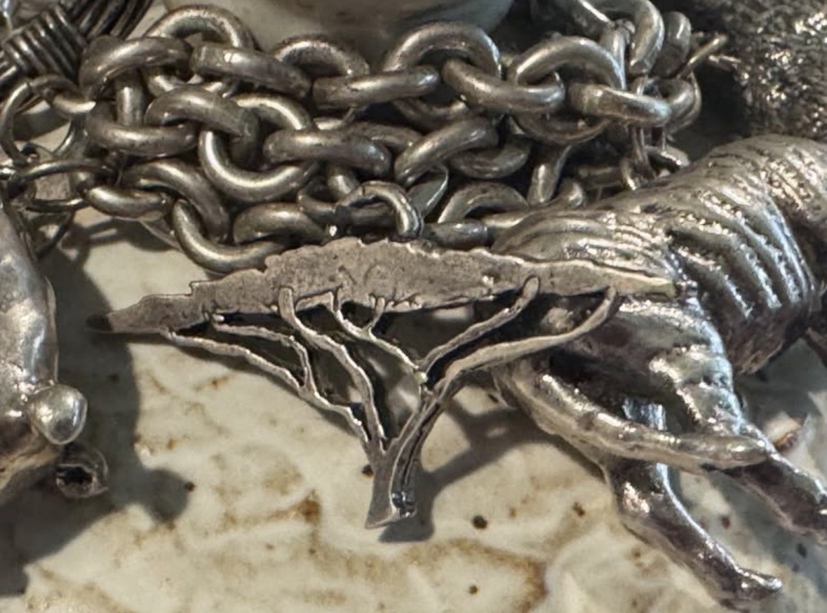 Signed Susan Cummings statement sterling silver African animal charm bracelet