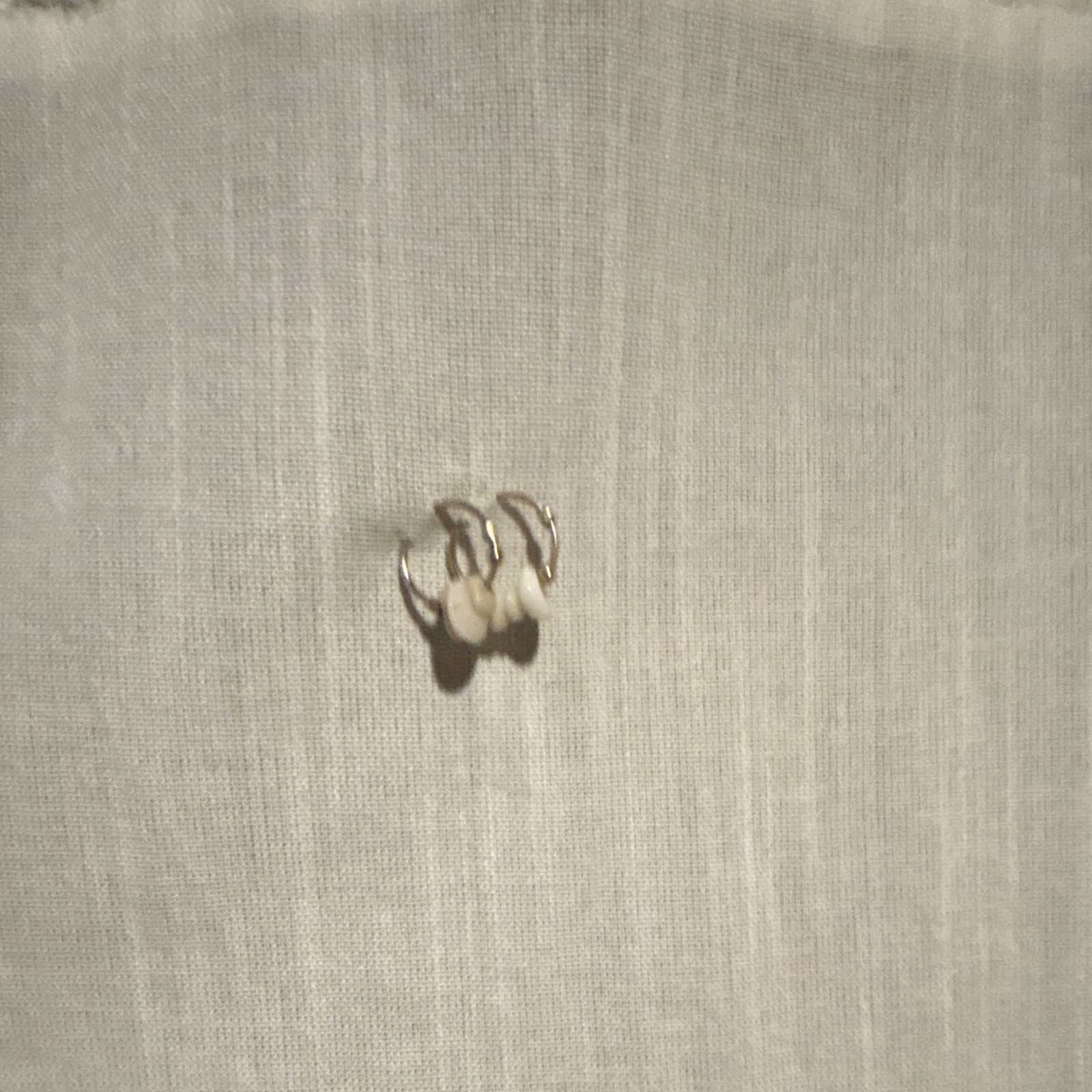 beige/white mini hoop pukashell earrings