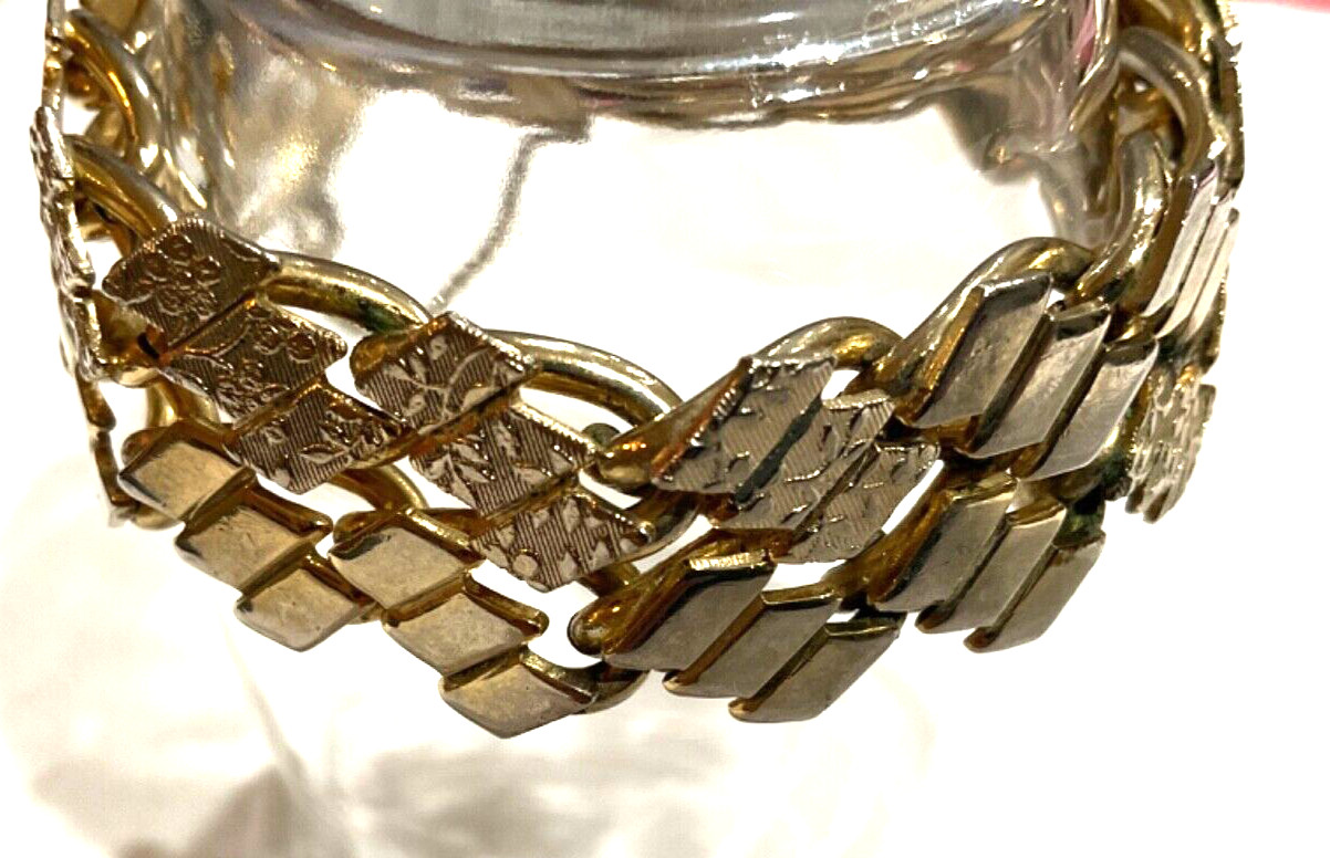 VTG ETCHED FLORAL DESIGN GOLD TONE BRACELET WITH SAFETY CHAIN FOLD OVER CLASP