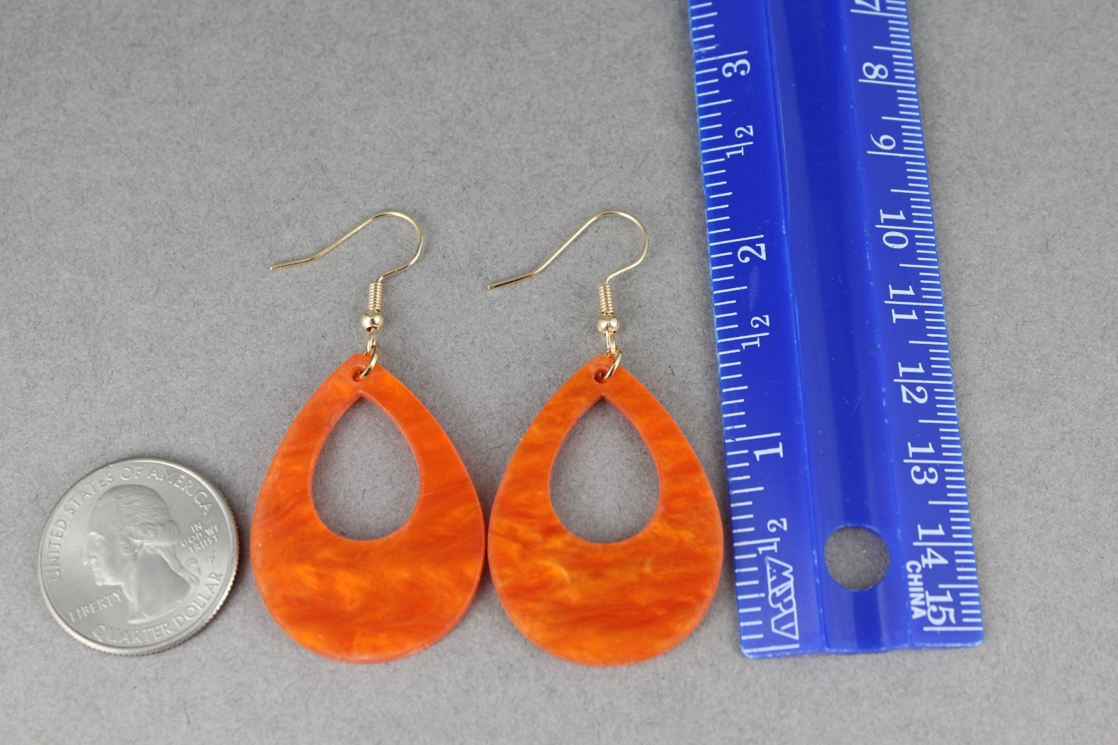 Orange teardrop earrings lightweight dangle cut out oval outline 2.25″ long