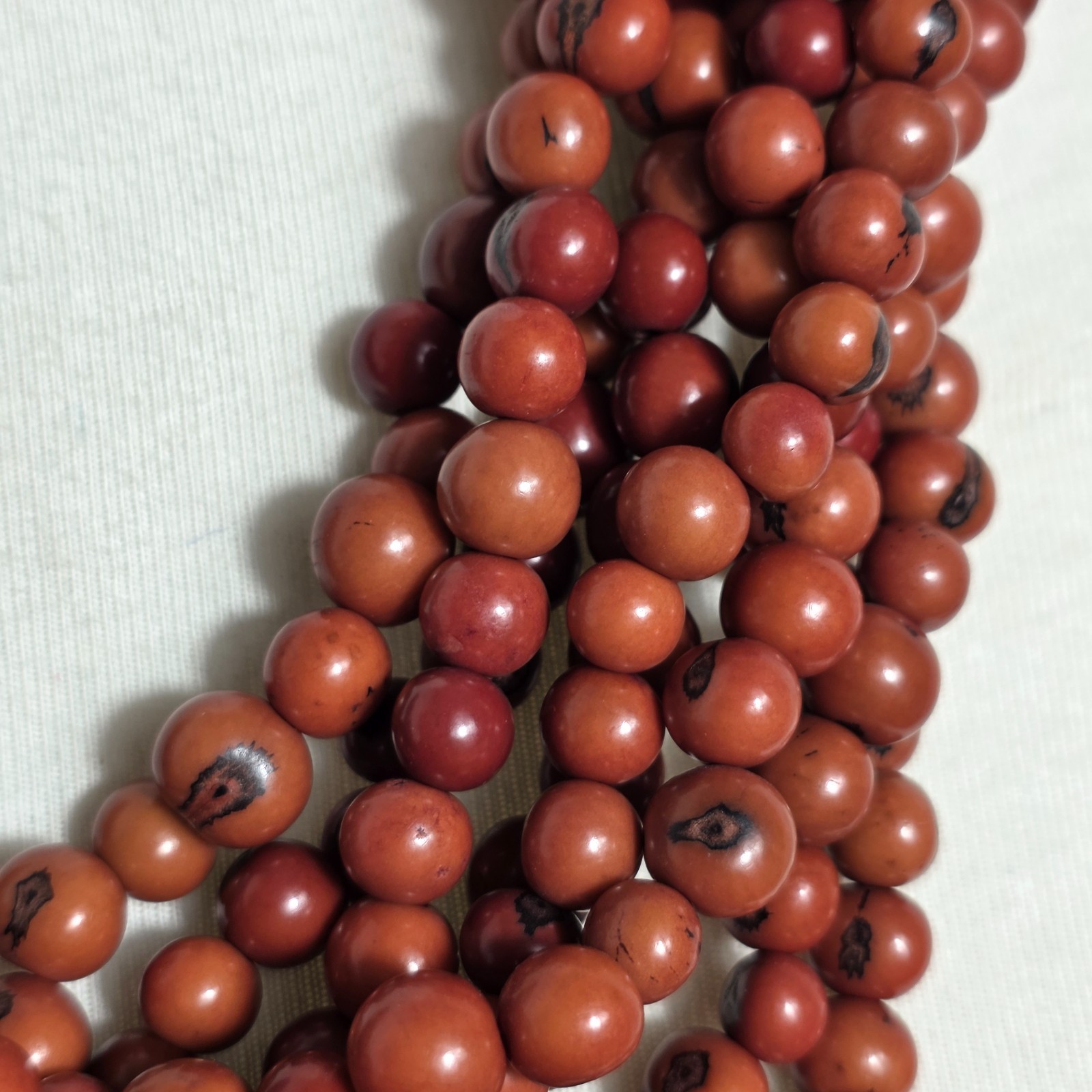 Multi-Strand Dyed Coral Colored Acai Seed Bead Necklace Gold Seed Bead Accents