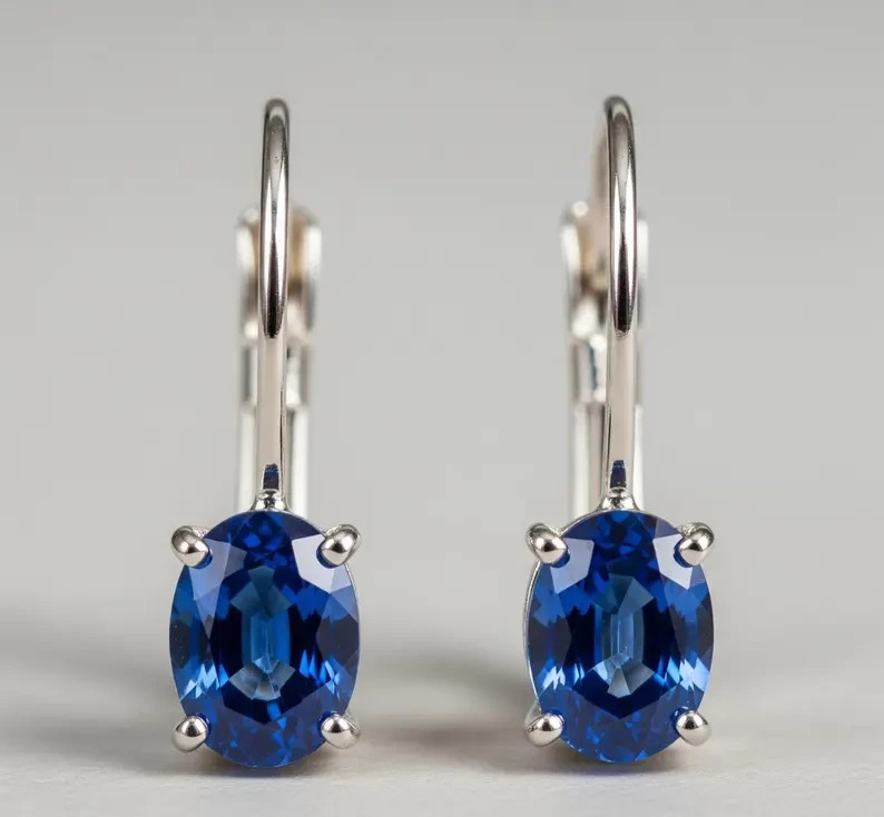 Stunning Lab-Created Oval Sapphire Lever Back Earrings in Sterling Silver
