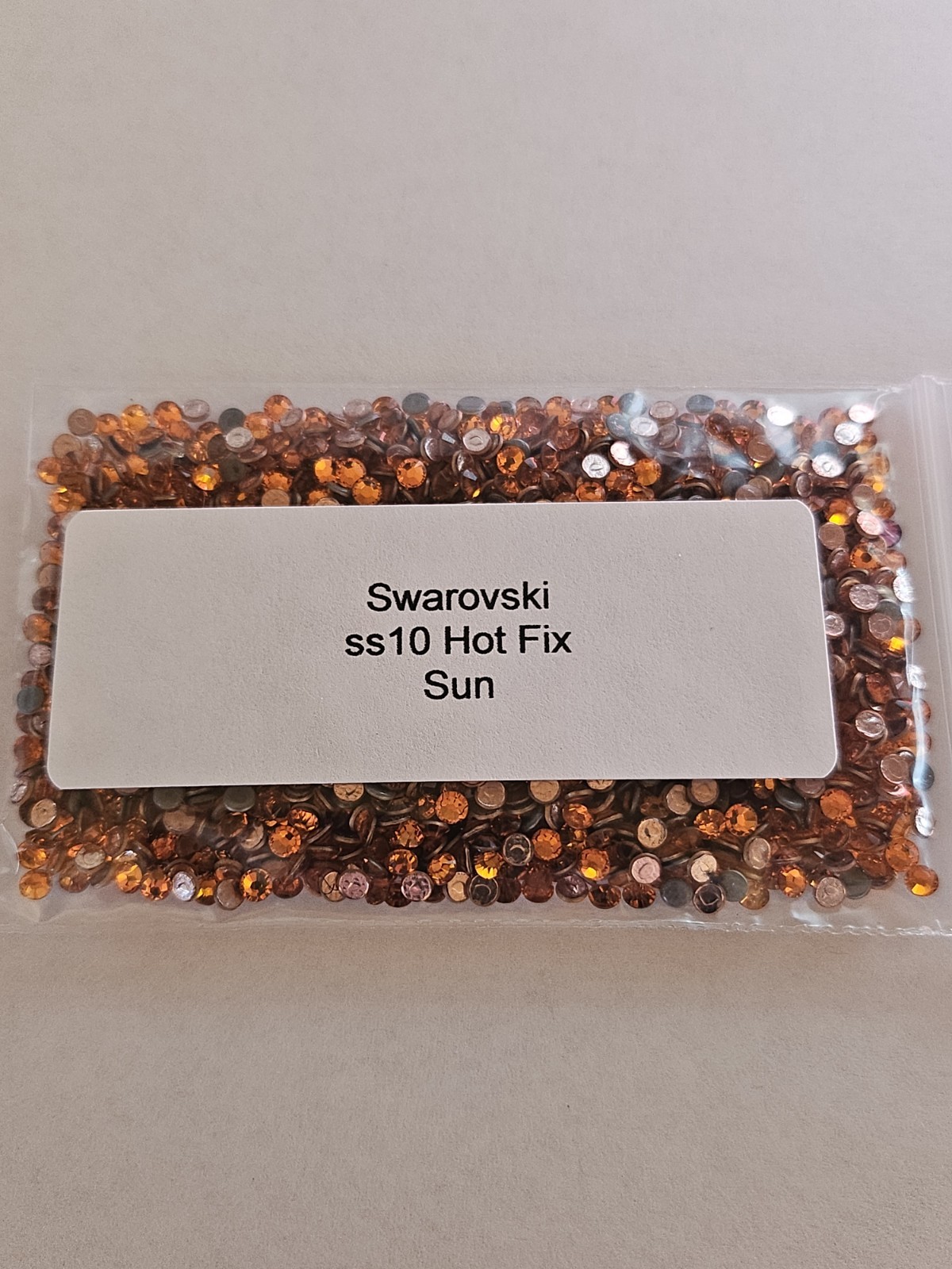 Genuine Swarovski ss10 Hot Fix Crystals in the color LIGHT COLORADO TOPAZ