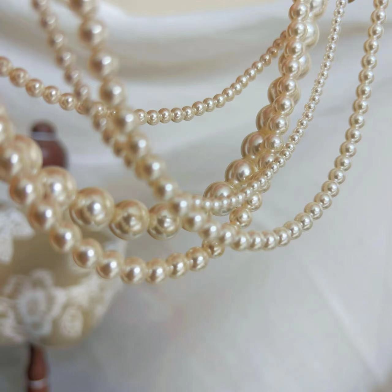 650 Warm White Perfectly Round High-Intensity Pearl Necklace