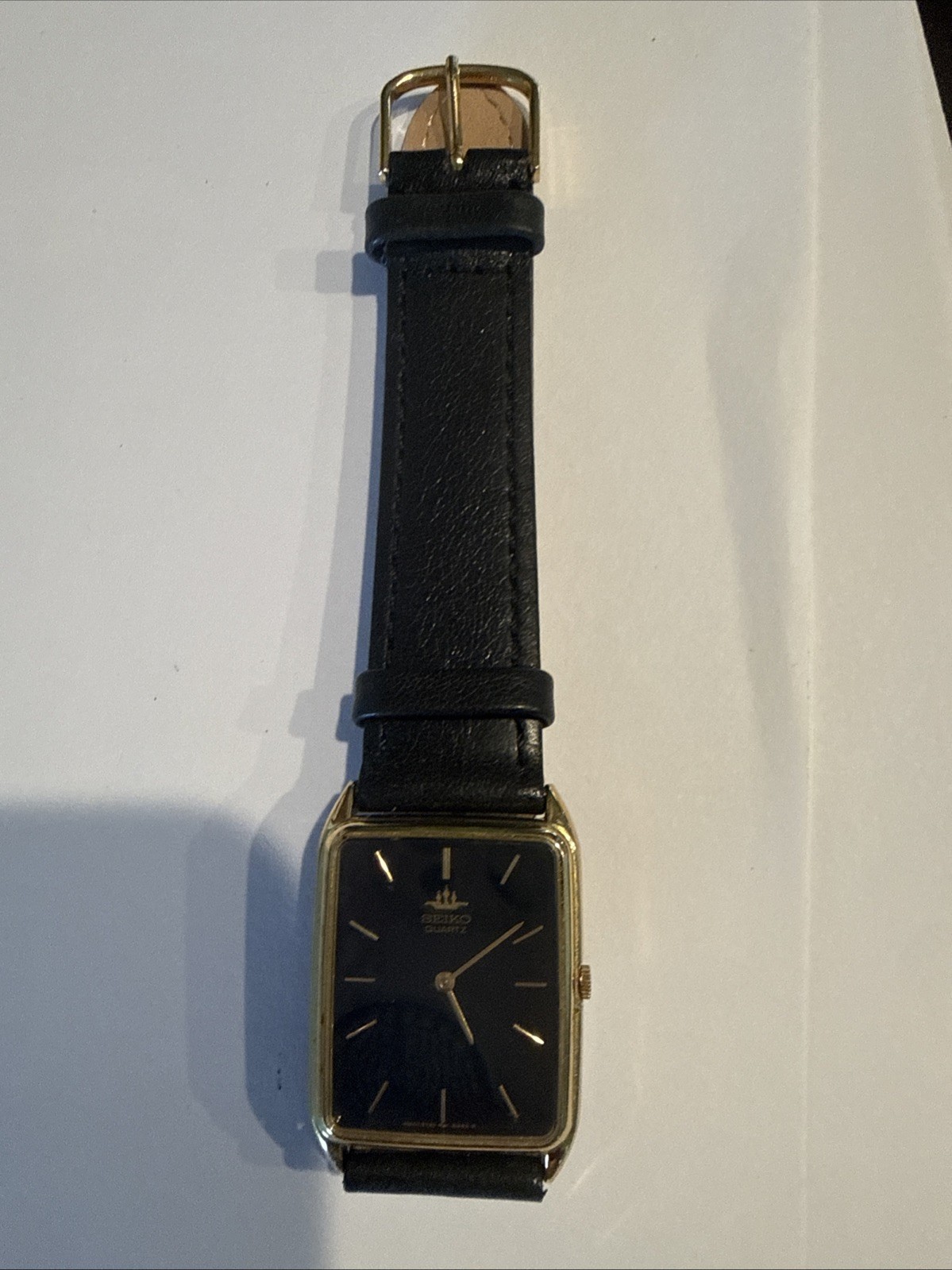 Seiko Men’s Gold Quartz Rectangular Wristwatch Black Dial Black Leather Band