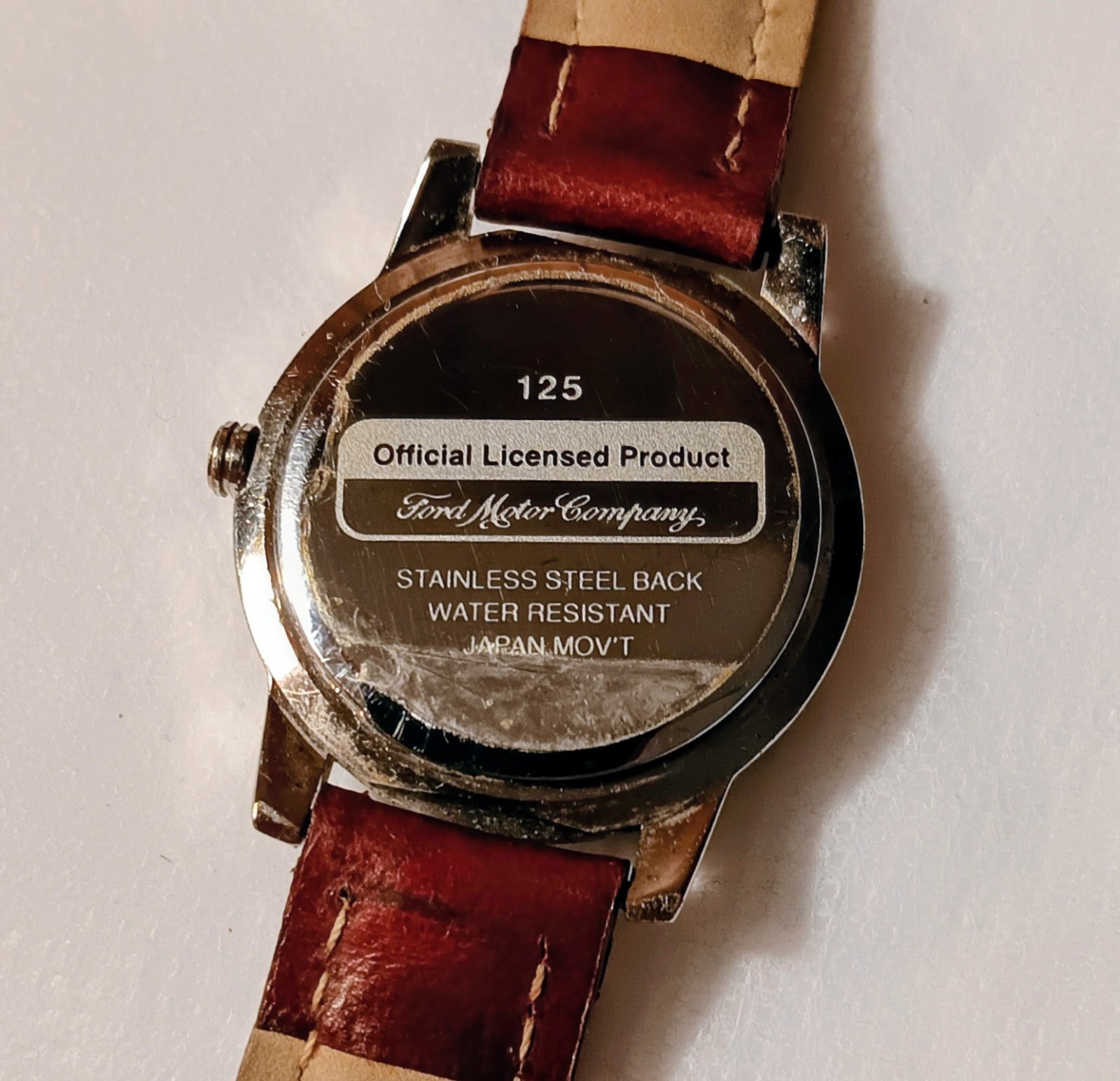 Ford Motor Company Quartz Analog Date White Logo Dial SS Brown Leather 30m