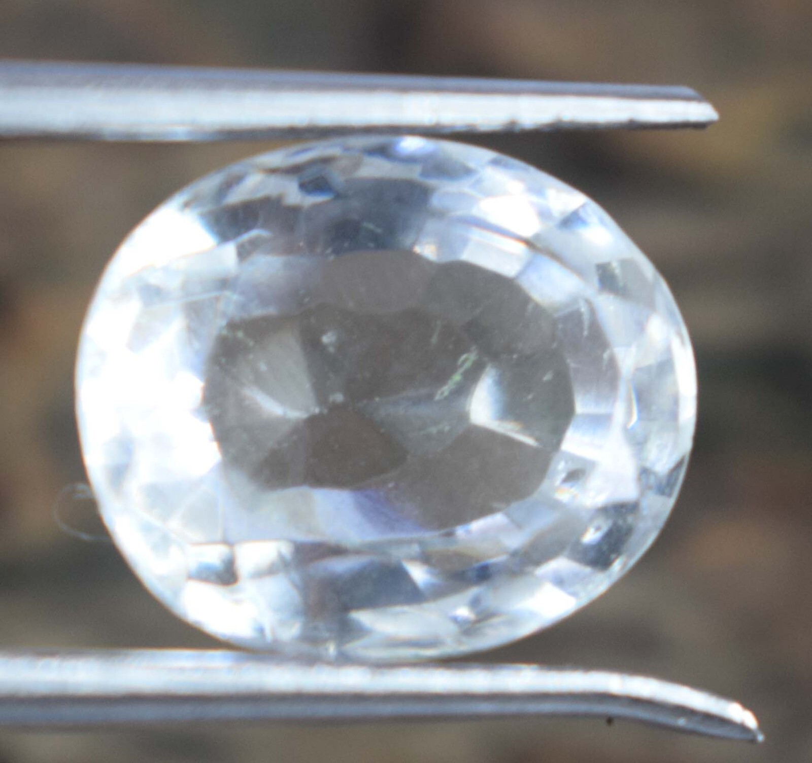White Montana Sapphire 9.05 Ct/12 mm Natural Oval Gemstone Certified B97819