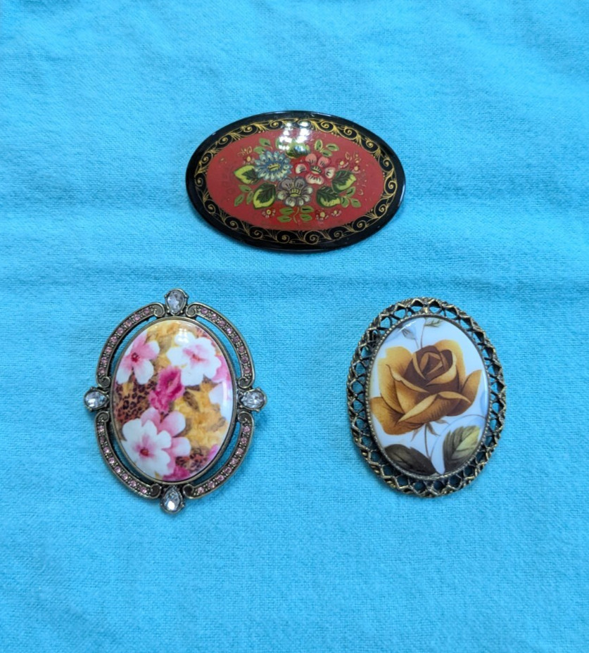 LOT/3 diff OVAL BROOCH/PINS w/diff FLORAL DESIGNS 2 Metals/1 RUSSIAN Black Wood